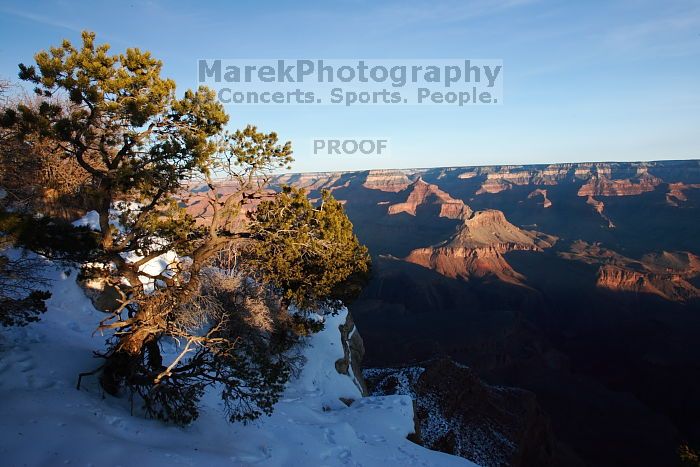 First sunrise of the new year at the south rim of the Grand Canyon, Thursday January 1, 2009.  The temperature was as low as 15 F the night before with a foot and a half of snow on the ground.  Luckily sunrise wasn't until 7:40.

Filename: SRM_20090101_08071837.JPG
Aperture: f/16.0
Shutter Speed: 1/20
Body: Canon EOS-1D Mark II
Lens: Canon EF 16-35mm f/2.8 L