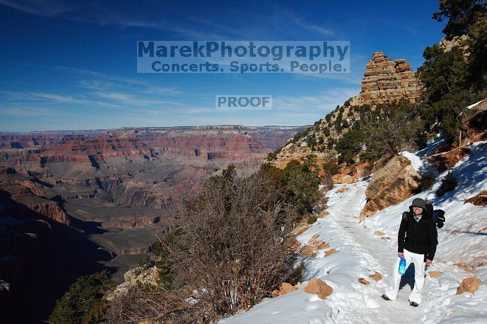 Beth Marek hiking down the South Kaibab trail, backpacking the Grand Canyon with Beth, Thursday, January 1, 2009.

Filename: SRM_20090101_12064867.jpg
Aperture: f/16.0
Shutter Speed: 1/250
Body: Canon EOS-1D Mark II
Lens: Canon EF 16-35mm f/2.8 L