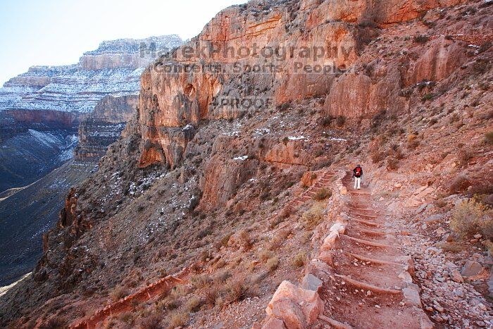 Beth Marek hiking down the South Kaibab trail, backpacking the Grand Canyon with Beth, Thursday, January 1, 2009.

Filename: SRM_20090101_14251642.jpg
Aperture: f/11.0
Shutter Speed: 1/25
Body: Canon EOS-1D Mark II
Lens: Canon EF 16-35mm f/2.8 L
