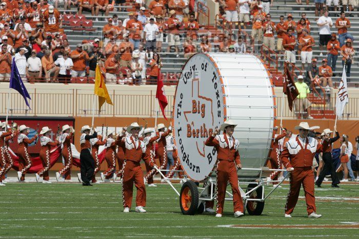 The UT marching band takes the field before the Arkansas football game.  The University of Texas football team defeated the Arkansas Razorbacks with a score of 52-10 in Austin, TX on Saturday, September 27, 2008.

Filename: SRM_20080927_14183009.jpg
Aperture: f/5.6
Shutter Speed: 1/2000
Body: Canon EOS-1D Mark II
Lens: Canon EF 300mm f/2.8 L IS