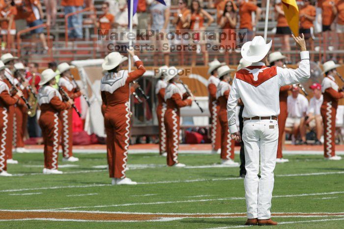 The UT marching band takes the field before the Arkansas football game.  The University of Texas football team defeated the Arkansas Razorbacks with a score of 52-10 in Austin, TX on Saturday, September 27, 2008.

Filename: SRM_20080927_14194217.jpg
Aperture: f/5.6
Shutter Speed: 1/1600
Body: Canon EOS-1D Mark II
Lens: Canon EF 300mm f/2.8 L IS