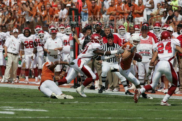 The University of Texas football team defeated the Arkansas Razorbacks with a score of 52-10 in Austin, TX on Saturday, September 27, 2008.

Filename: SRM_20080927_14400281.jpg
Aperture: f/5.6
Shutter Speed: 1/4000
Body: Canon EOS-1D Mark II
Lens: Canon EF 300mm f/2.8 L IS