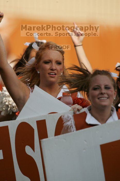 Texas Cheerleaders.  The University of Texas football team defeated the Arkansas Razorbacks with a score of 52-10 in Austin, TX on Saturday, September 27, 2008.

Filename: SRM_20080927_17030090.jpg
Aperture: f/5.6
Shutter Speed: 1/2000
Body: Canon EOS-1D Mark II
Lens: Canon EF 300mm f/2.8 L IS