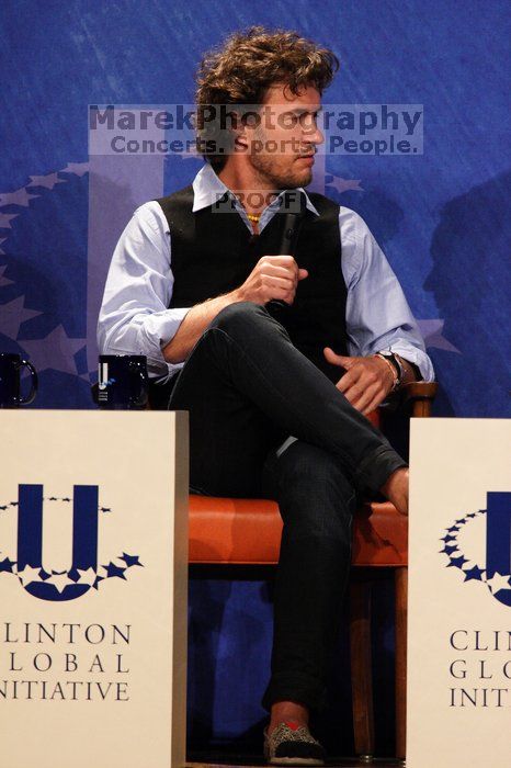 Blake Mycoskie, founder of TOMS shoes, donates one pair of shoes to a third world country for every pair of shoes they sell. Day one of the 2nd Annual Clinton Global Initiative University (CGIU) meeting was held at The University of Texas at Austin, Friday, February 13, 2009.
Filename: SRM_20090213_17103872.jpg
Aperture: f/5.6
Shutter Speed: 1/250
Body: Canon EOS 20D
Lens: Canon EF 300mm f/2.8 L IS
