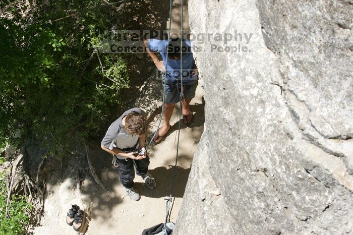 Andrew Dreher getting ready to climb Lick the Window (5.10c) with Javier Morales belaying, shot from the top of Ack! (5.11b, but using the crack for the start instead) that I top roped up with my camera on my back.  It was another long day of rock climbing at Seismic Wall on Austin's Barton Creek Greenbelt, Sunday, April 5, 2009.

Filename: SRM_20090405_13134302.jpg
Aperture: f/10.0
Shutter Speed: 1/400
Body: Canon EOS-1D Mark II
Lens: Canon EF 80-200mm f/2.8 L