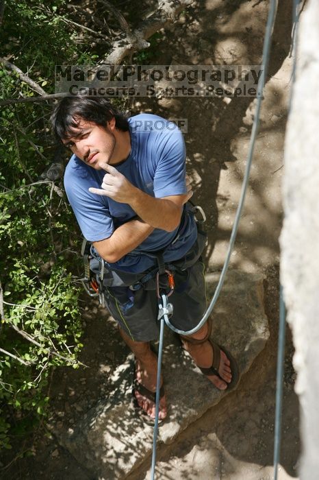 Javier Morales getting ready to belay, shot from the top of Ack! (5.11b, but using the crack for the start instead) that I top roped up with my camera on my back.  It was another long day of rock climbing at Seismic Wall on Austin's Barton Creek Greenbelt, Sunday, April 5, 2009.

Filename: SRM_20090405_13143203.jpg
Aperture: f/5.0
Shutter Speed: 1/500
Body: Canon EOS-1D Mark II
Lens: Canon EF 80-200mm f/2.8 L