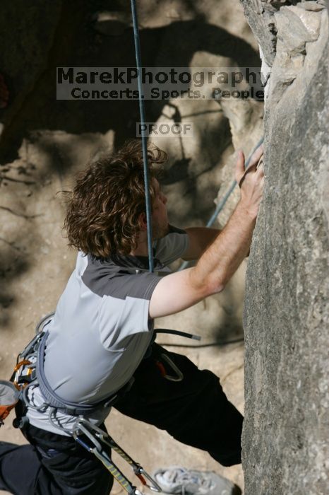 Andrew Dreher attempting the dyno while leading Lick the Window (5.10c), shot from the top of Ack! (5.11b, but using the crack for the start instead) that I top roped up with my camera on my back.  It was another long day of rock climbing at Seismic Wall on Austin's Barton Creek Greenbelt, Sunday, April 5, 2009.

Filename: SRM_20090405_13155912.jpg
Aperture: f/10.0
Shutter Speed: 1/500
Body: Canon EOS-1D Mark II
Lens: Canon EF 80-200mm f/2.8 L