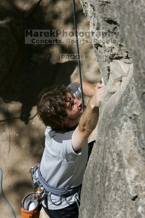Andrew Dreher attempting the dyno while leading Lick the Window (5.10c), shot from the top of Ack! (5.11b, but using the crack for the start instead) that I top roped up with my camera on my back.  It was another long day of rock climbing at Seismic Wall on Austin's Barton Creek Greenbelt, Sunday, April 5, 2009.

Filename: SRM_20090405_13171031.jpg
Aperture: f/9.0
Shutter Speed: 1/500
Body: Canon EOS-1D Mark II
Lens: Canon EF 80-200mm f/2.8 L