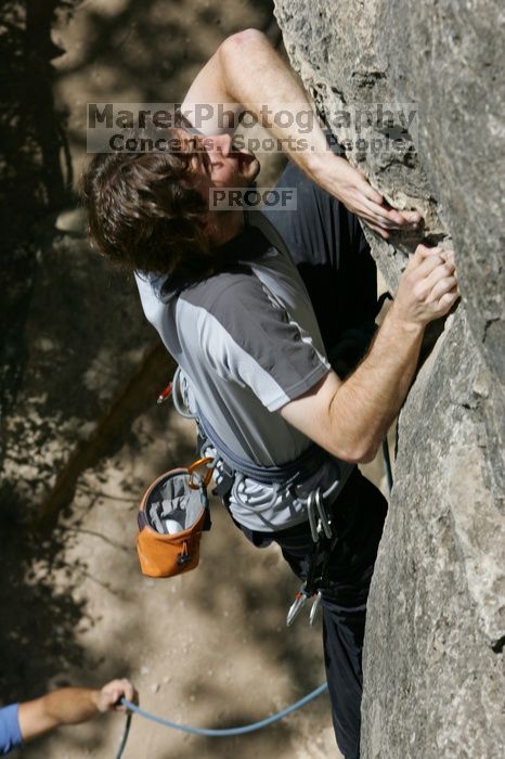 Andrew Dreher leading Lick the Window (5.10c), shot from the top of Ack! (5.11b, but using the crack for the start instead) that I top roped up with my camera on my back.  It was another long day of rock climbing at Seismic Wall on Austin's Barton Creek Greenbelt, Sunday, April 5, 2009.

Filename: SRM_20090405_13215057.jpg
Aperture: f/10.0
Shutter Speed: 1/500
Body: Canon EOS-1D Mark II
Lens: Canon EF 80-200mm f/2.8 L