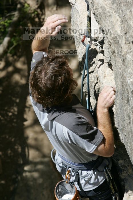 Andrew Dreher leading Lick the Window (5.10c), shot from the top of Ack! (5.11b, but using the crack for the start instead) that I top roped up with my camera on my back.  It was another long day of rock climbing at Seismic Wall on Austin's Barton Creek Greenbelt, Sunday, April 5, 2009.

Filename: SRM_20090405_13221071.jpg
Aperture: f/8.0
Shutter Speed: 1/500
Body: Canon EOS-1D Mark II
Lens: Canon EF 80-200mm f/2.8 L