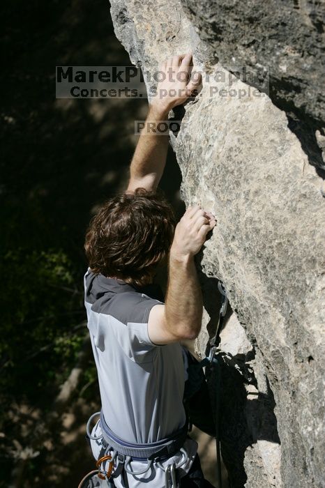 Andrew Dreher leading Lick the Window (5.10c), shot from the top of Ack! (5.11b, but using the crack for the start instead) that I top roped up with my camera on my back.  It was another long day of rock climbing at Seismic Wall on Austin's Barton Creek Greenbelt, Sunday, April 5, 2009.

Filename: SRM_20090405_13225389.jpg
Aperture: f/7.1
Shutter Speed: 1/500
Body: Canon EOS-1D Mark II
Lens: Canon EF 80-200mm f/2.8 L