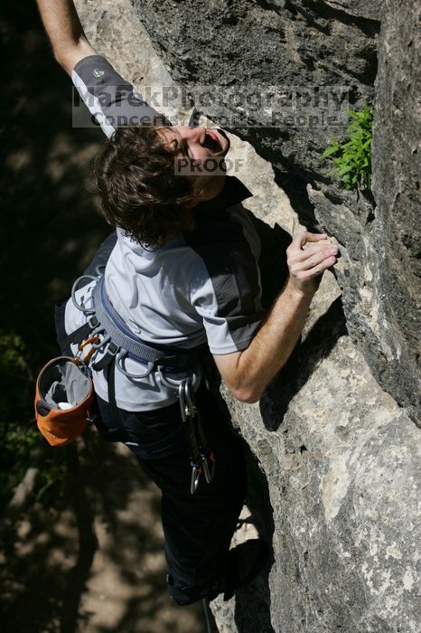 Andrew Dreher leading Lick the Window (5.10c), shot from the top of Ack! (5.11b, but using the crack for the start instead) that I top roped up with my camera on my back.  It was another long day of rock climbing at Seismic Wall on Austin's Barton Creek Greenbelt, Sunday, April 5, 2009.

Filename: SRM_20090405_13230713.jpg
Aperture: f/8.0
Shutter Speed: 1/500
Body: Canon EOS-1D Mark II
Lens: Canon EF 80-200mm f/2.8 L