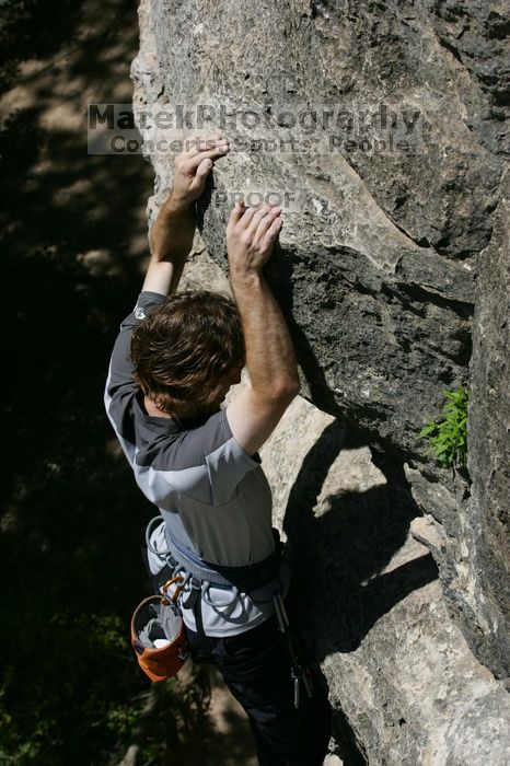Andrew Dreher leading Lick the Window (5.10c), shot from the top of Ack! (5.11b, but using the crack for the start instead) that I top roped up with my camera on my back.  It was another long day of rock climbing at Seismic Wall on Austin's Barton Creek Greenbelt, Sunday, April 5, 2009.

Filename: SRM_20090405_13231216.jpg
Aperture: f/8.0
Shutter Speed: 1/500
Body: Canon EOS-1D Mark II
Lens: Canon EF 80-200mm f/2.8 L