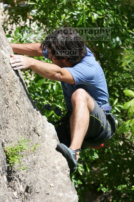 Javier Morales leading Nose Print on the Windshield (5.11c), shot from the top of Ack! (5.11b, but using the crack for the start instead) that I top roped up with my camera on my back.  It was another long day of rock climbing at Seismic Wall on Austin's Barton Creek Greenbelt, Sunday, April 5, 2009.

Filename: SRM_20090405_13342998.jpg
Aperture: f/8.0
Shutter Speed: 1/500
Body: Canon EOS-1D Mark II
Lens: Canon EF 80-200mm f/2.8 L