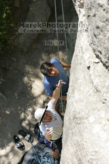 Me preparing to top rope Lick the Window (5.10c), shot (by Andrew Dreher) from the top of Ack! (5.11b, but using the crack for the start instead) that I top roped up with my camera on my back.  It was another long day of rock climbing at Seismic Wall on Austin's Barton Creek Greenbelt, Sunday, April 5, 2009.

Filename: SRM_20090405_14354226.jpg
Aperture: f/6.3
Shutter Speed: 1/500
Body: Canon EOS-1D Mark II
Lens: Canon EF 80-200mm f/2.8 L