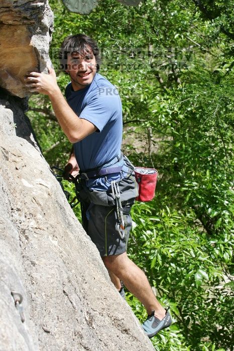 Javier Morales leading Nose Print on the Windshield (5.11c), shot from the top of Ack! (5.11b, but using the crack for the start instead) that I top roped up with my camera on my back.  It was another long day of rock climbing at Seismic Wall on Austin's Barton Creek Greenbelt, Sunday, April 5, 2009.

Filename: SRM_20090405_14563186.jpg
Aperture: f/8.0
Shutter Speed: 1/500
Body: Canon EOS-1D Mark II
Lens: Canon EF 80-200mm f/2.8 L