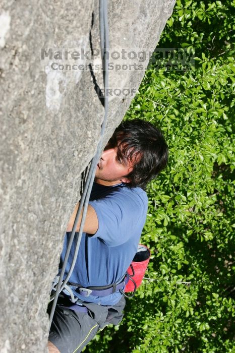 Javier Morales top rope climbing She's No Dog, She's My Wife (5.11b), shot from the top of Ack! (5.11b, but using the crack for the start instead) that I top roped up with my camera on my back.  It was another long day of rock climbing at Seismic Wall on Austin's Barton Creek Greenbelt, Sunday, April 5, 2009.

Filename: SRM_20090405_16171693.jpg
Aperture: f/10.0
Shutter Speed: 1/500
Body: Canon EOS-1D Mark II
Lens: Canon EF 80-200mm f/2.8 L