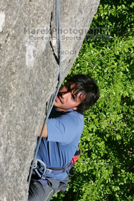 Javier Morales top rope climbing She's No Dog, She's My Wife (5.11b), shot from the top of Ack! (5.11b, but using the crack for the start instead) that I top roped up with my camera on my back.  It was another long day of rock climbing at Seismic Wall on Austin's Barton Creek Greenbelt, Sunday, April 5, 2009.

Filename: SRM_20090405_16171695.jpg
Aperture: f/11.0
Shutter Speed: 1/500
Body: Canon EOS-1D Mark II
Lens: Canon EF 80-200mm f/2.8 L