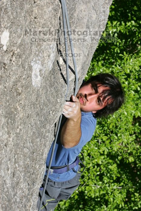 Javier Morales top rope climbing She's No Dog, She's My Wife (5.11b), shot from the top of Ack! (5.11b, but using the crack for the start instead) that I top roped up with my camera on my back.  It was another long day of rock climbing at Seismic Wall on Austin's Barton Creek Greenbelt, Sunday, April 5, 2009.

Filename: SRM_20090405_16172301.jpg
Aperture: f/11.0
Shutter Speed: 1/500
Body: Canon EOS-1D Mark II
Lens: Canon EF 80-200mm f/2.8 L