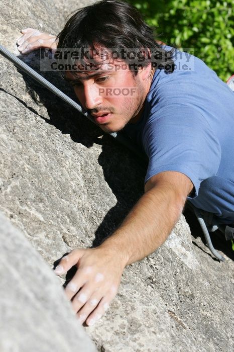 Javier Morales top rope climbing She's No Dog, She's My Wife (5.11b), shot from the top of Ack! (5.11b, but using the crack for the start instead) that I top roped up with my camera on my back.  It was another long day of rock climbing at Seismic Wall on Austin's Barton Creek Greenbelt, Sunday, April 5, 2009.

Filename: SRM_20090405_16184028.jpg
Aperture: f/9.0
Shutter Speed: 1/400
Body: Canon EOS-1D Mark II
Lens: Canon EF 80-200mm f/2.8 L