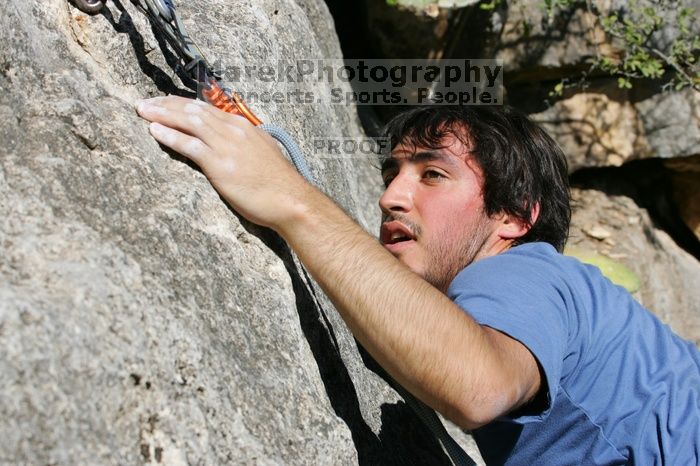 Javier Morales top rope climbing She's No Dog, She's My Wife (5.11b), shot from the top of Ack! (5.11b, but using the crack for the start instead) that I top roped up with my camera on my back.  It was another long day of rock climbing at Seismic Wall on Austin's Barton Creek Greenbelt, Sunday, April 5, 2009.

Filename: SRM_20090405_16191829.jpg
Aperture: f/10.0
Shutter Speed: 1/400
Body: Canon EOS-1D Mark II
Lens: Canon EF 80-200mm f/2.8 L