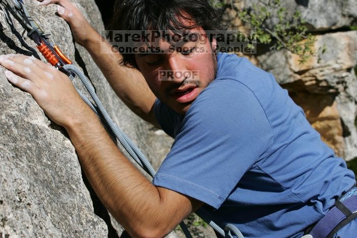 Javier Morales top rope climbing She's No Dog, She's My Wife (5.11b), shot from the top of Ack! (5.11b, but using the crack for the start instead) that I top roped up with my camera on my back.  It was another long day of rock climbing at Seismic Wall on Austin's Barton Creek Greenbelt, Sunday, April 5, 2009.

Filename: SRM_20090405_16192030.jpg
Aperture: f/11.0
Shutter Speed: 1/400
Body: Canon EOS-1D Mark II
Lens: Canon EF 80-200mm f/2.8 L