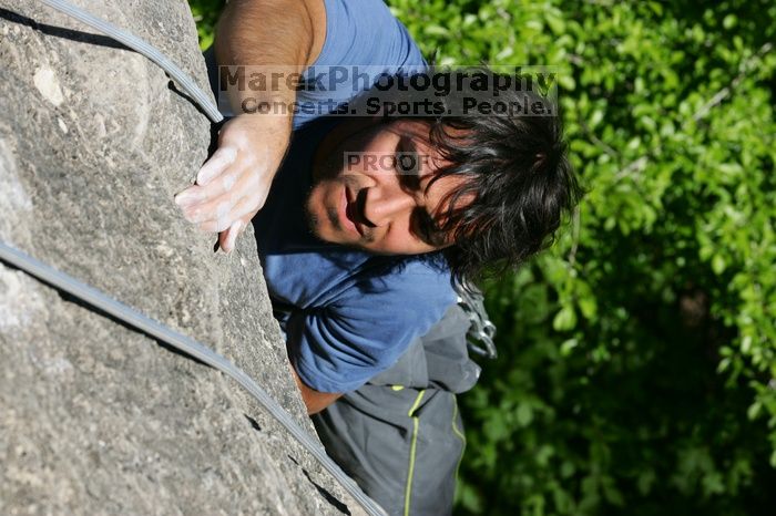 Javier Morales top rope climbing She's No Dog, She's My Wife (5.11b), shot from the top of Ack! (5.11b, but using the crack for the start instead) that I top roped up with my camera on my back.  It was another long day of rock climbing at Seismic Wall on Austin's Barton Creek Greenbelt, Sunday, April 5, 2009.

Filename: SRM_20090405_16481448.jpg
Aperture: f/8.0
Shutter Speed: 1/500
Body: Canon EOS-1D Mark II
Lens: Canon EF 80-200mm f/2.8 L