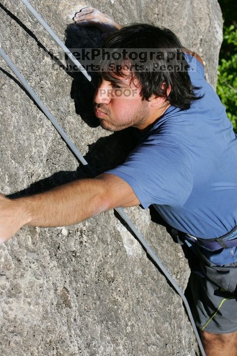 Javier Morales top rope climbing She's No Dog, She's My Wife (5.11b), shot from the top of Ack! (5.11b, but using the crack for the start instead) that I top roped up with my camera on my back.  It was another long day of rock climbing at Seismic Wall on Austin's Barton Creek Greenbelt, Sunday, April 5, 2009.

Filename: SRM_20090405_16483662.jpg
Aperture: f/9.0
Shutter Speed: 1/500
Body: Canon EOS-1D Mark II
Lens: Canon EF 80-200mm f/2.8 L
