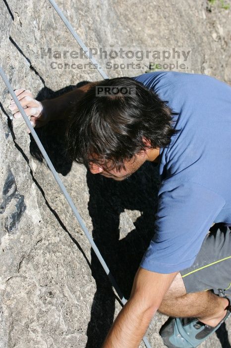Javier Morales top rope climbing She's No Dog, She's My Wife (5.11b), shot from the top of Ack! (5.11b, but using the crack for the start instead) that I top roped up with my camera on my back.  It was another long day of rock climbing at Seismic Wall on Austin's Barton Creek Greenbelt, Sunday, April 5, 2009.

Filename: SRM_20090405_16485066.jpg
Aperture: f/8.0
Shutter Speed: 1/500
Body: Canon EOS-1D Mark II
Lens: Canon EF 80-200mm f/2.8 L