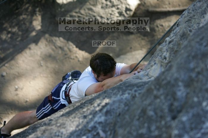 Me top roping Lick the Window (5.10c), shot by Javier Morales from the top of Ack! (5.11b, but using the crack for the start instead) that I top roped up with my camera on my back.  It was another long day of rock climbing at Seismic Wall on Austin's Barton Creek Greenbelt, Sunday, April 5, 2009.

Filename: SRM_20090405_17181715.jpg
Aperture: f/3.2
Shutter Speed: 1/400
Body: Canon EOS-1D Mark II
Lens: Canon EF 80-200mm f/2.8 L