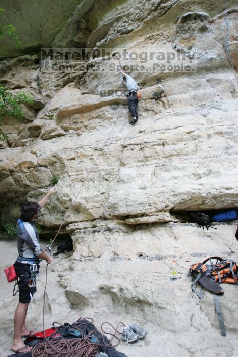 Andrew Dreher lead climbing Magster (5.10a) with Javier Morales belaying.  It was another long day of rock climbing at Seismic Wall on Austin's Barton Creek Greenbelt, Saturday, April 11, 2009.

Filename: SRM_20090411_15311383.JPG
Aperture: f/4.0
Shutter Speed: 1/250
Body: Canon EOS-1D Mark II
Lens: Canon EF 16-35mm f/2.8 L