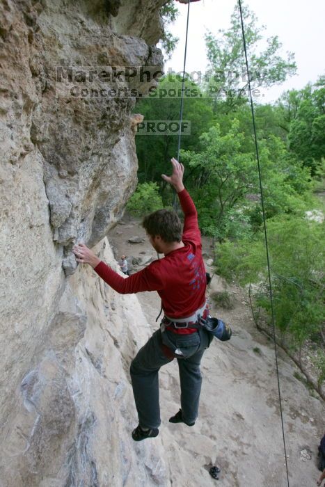 Me top rope climbing Diving for Rocks (5.10d), photographed from  the third bolt of Magster (5.10a) by Andrew Dreher.  It was another long day of rock climbing at Seismic Wall on Austin's Barton Creek Greenbelt, Saturday, April 11, 2009.

Filename: SRM_20090411_17051100.JPG
Aperture: f/5.6
Shutter Speed: 1/320
Body: Canon EOS-1D Mark II
Lens: Canon EF 16-35mm f/2.8 L