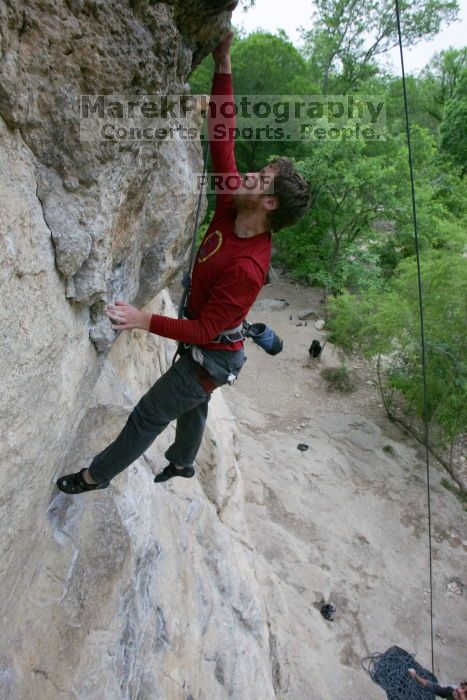 Me top rope climbing Diving for Rocks (5.10d), photographed from  the third bolt of Magster (5.10a) by Andrew Dreher.  It was another long day of rock climbing at Seismic Wall on Austin's Barton Creek Greenbelt, Saturday, April 11, 2009.

Filename: SRM_20090411_17051196.JPG
Aperture: f/5.6
Shutter Speed: 1/320
Body: Canon EOS-1D Mark II
Lens: Canon EF 16-35mm f/2.8 L