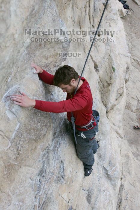Me top rope climbing Diving for Rocks (5.10d), photographed from  the third bolt of Magster (5.10a) by Andrew Dreher.  It was another long day of rock climbing at Seismic Wall on Austin's Barton Creek Greenbelt, Saturday, April 11, 2009.

Filename: SRM_20090411_17071109.JPG
Aperture: f/5.6
Shutter Speed: 1/320
Body: Canon EOS-1D Mark II
Lens: Canon EF 16-35mm f/2.8 L