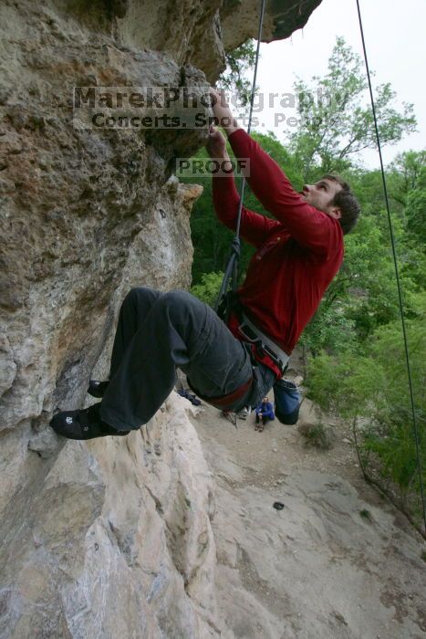 Me top rope climbing Diving for Rocks (5.10d), photographed from  the third bolt of Magster (5.10a) by Andrew Dreher.  It was another long day of rock climbing at Seismic Wall on Austin's Barton Creek Greenbelt, Saturday, April 11, 2009.

Filename: SRM_20090411_17132822.JPG
Aperture: f/5.6
Shutter Speed: 1/320
Body: Canon EOS-1D Mark II
Lens: Canon EF 16-35mm f/2.8 L