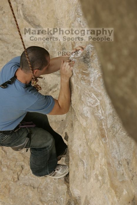 Sean O'Grady climbs in just running shoes.  CTM hosted a speed climbing event at Seismic Wall on Diving for Rocks to benefit the Austin Area Food Bank, Saturday, May 9, 2009.

Filename: SRM_20090509_11312288.jpg
Aperture: f/5.6
Shutter Speed: 1/1250
Body: Canon EOS-1D Mark II
Lens: Canon EF 80-200mm f/2.8 L