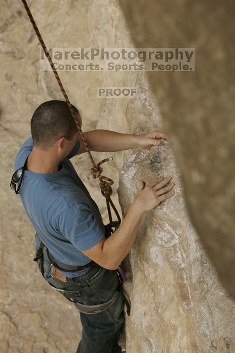 Sean O'Grady climbs in just running shoes.  CTM hosted a speed climbing event at Seismic Wall on Diving for Rocks to benefit the Austin Area Food Bank, Saturday, May 9, 2009.

Filename: SRM_20090509_11312289.jpg
Aperture: f/5.6
Shutter Speed: 1/1250
Body: Canon EOS-1D Mark II
Lens: Canon EF 80-200mm f/2.8 L