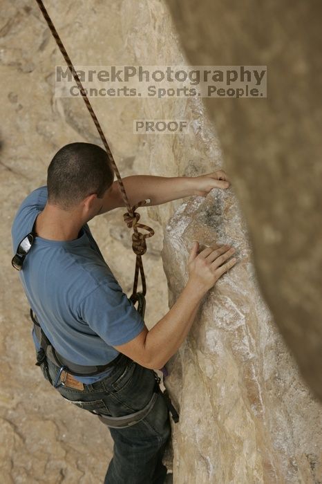 Sean O'Grady climbs in just running shoes.  CTM hosted a speed climbing event at Seismic Wall on Diving for Rocks to benefit the Austin Area Food Bank, Saturday, May 9, 2009.

Filename: SRM_20090509_11312390.jpg
Aperture: f/5.6
Shutter Speed: 1/1250
Body: Canon EOS-1D Mark II
Lens: Canon EF 80-200mm f/2.8 L