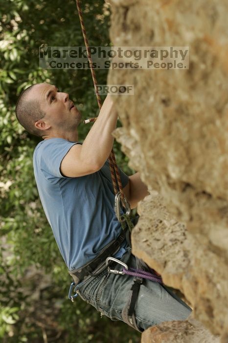 Sean O'Grady climbs in just running shoes.  CTM hosted a speed climbing event at Seismic Wall on Diving for Rocks to benefit the Austin Area Food Bank, Saturday, May 9, 2009.

Filename: SRM_20090509_11315401.jpg
Aperture: f/5.6
Shutter Speed: 1/500
Body: Canon EOS-1D Mark II
Lens: Canon EF 80-200mm f/2.8 L