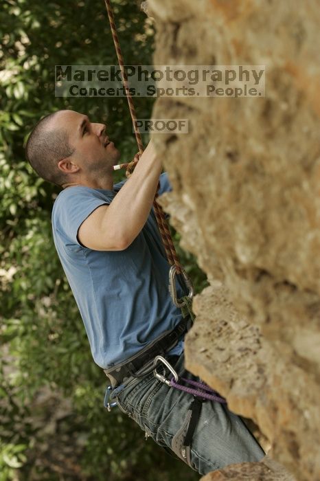 Sean O'Grady climbs in just running shoes.  CTM hosted a speed climbing event at Seismic Wall on Diving for Rocks to benefit the Austin Area Food Bank, Saturday, May 9, 2009.

Filename: SRM_20090509_11315503.jpg
Aperture: f/5.6
Shutter Speed: 1/640
Body: Canon EOS-1D Mark II
Lens: Canon EF 80-200mm f/2.8 L