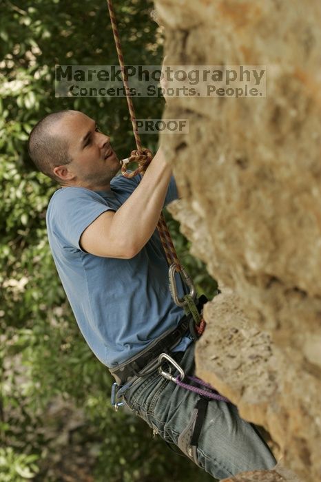 Sean O'Grady climbs in just running shoes.  CTM hosted a speed climbing event at Seismic Wall on Diving for Rocks to benefit the Austin Area Food Bank, Saturday, May 9, 2009.

Filename: SRM_20090509_11315506.jpg
Aperture: f/5.6
Shutter Speed: 1/500
Body: Canon EOS-1D Mark II
Lens: Canon EF 80-200mm f/2.8 L