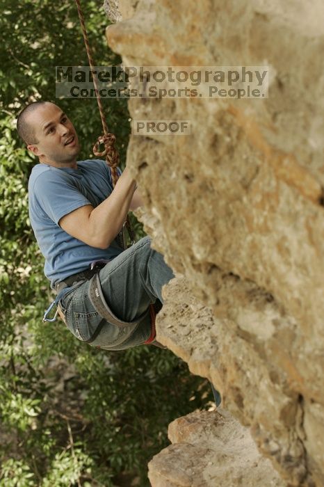 Sean O'Grady climbs in just running shoes.  CTM hosted a speed climbing event at Seismic Wall on Diving for Rocks to benefit the Austin Area Food Bank, Saturday, May 9, 2009.

Filename: SRM_20090509_11315708.jpg
Aperture: f/5.6
Shutter Speed: 1/500
Body: Canon EOS-1D Mark II
Lens: Canon EF 80-200mm f/2.8 L