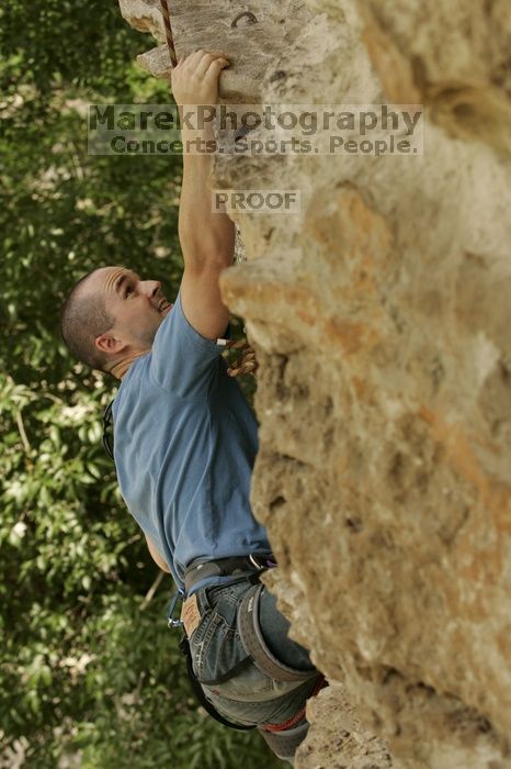 Sean O'Grady climbs in just running shoes.  CTM hosted a speed climbing event at Seismic Wall on Diving for Rocks to benefit the Austin Area Food Bank, Saturday, May 9, 2009.

Filename: SRM_20090509_11315911.jpg
Aperture: f/5.6
Shutter Speed: 1/640
Body: Canon EOS-1D Mark II
Lens: Canon EF 80-200mm f/2.8 L