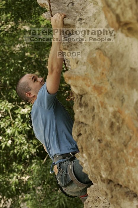 Sean O'Grady climbs in just running shoes.  CTM hosted a speed climbing event at Seismic Wall on Diving for Rocks to benefit the Austin Area Food Bank, Saturday, May 9, 2009.

Filename: SRM_20090509_11320012.jpg
Aperture: f/5.6
Shutter Speed: 1/640
Body: Canon EOS-1D Mark II
Lens: Canon EF 80-200mm f/2.8 L