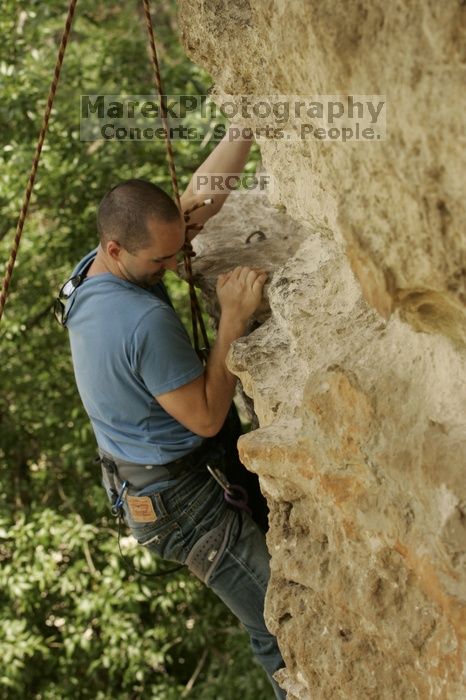 Sean O'Grady climbs in just running shoes.  CTM hosted a speed climbing event at Seismic Wall on Diving for Rocks to benefit the Austin Area Food Bank, Saturday, May 9, 2009.

Filename: SRM_20090509_11320422.jpg
Aperture: f/5.6
Shutter Speed: 1/500
Body: Canon EOS-1D Mark II
Lens: Canon EF 80-200mm f/2.8 L