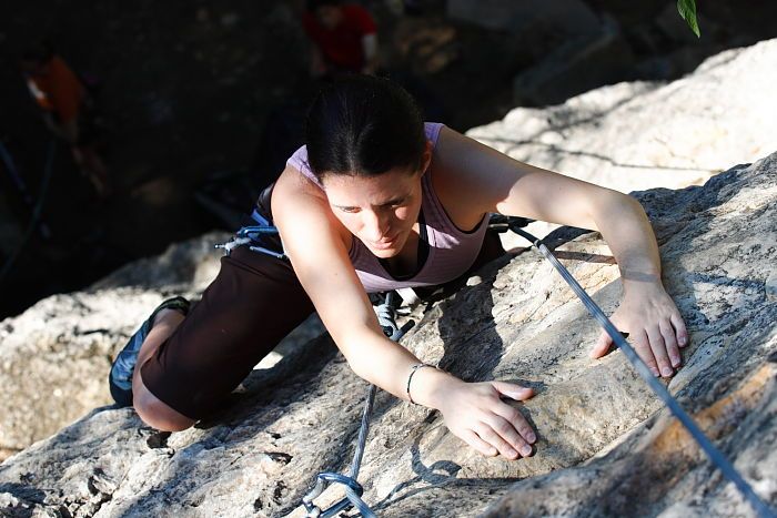 Beth Marek top rope climbing Roo Dog (5.8), taken from the anchors of the route.  It was Beth's third time outside, and another long day of rock climbing at Seismic Wall on Austin's Barton Creek Greenbelt, Monday, May 25, 2009.

Filename: SRM_20090525_09520293.JPG
Aperture: f/5.6
Shutter Speed: 1/500
Body: Canon EOS-1D Mark II
Lens: Canon EF 80-200mm f/2.8 L