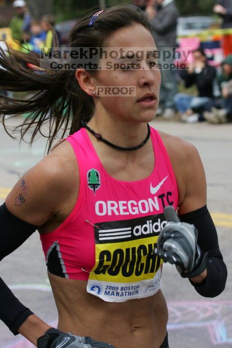 Kara Goucher was the third female to cross the finish line with a time of 2:32:25.  The 113th Boston Marathon took place on Monday, April 20, 2009.

Filename: SRM_20090420_10334009.JPG
Aperture: f/8.0
Shutter Speed: 1/800
Body: Canon EOS-1D Mark II
Lens: Canon EF 100-400mm f/4.5-5.6 L IS USM