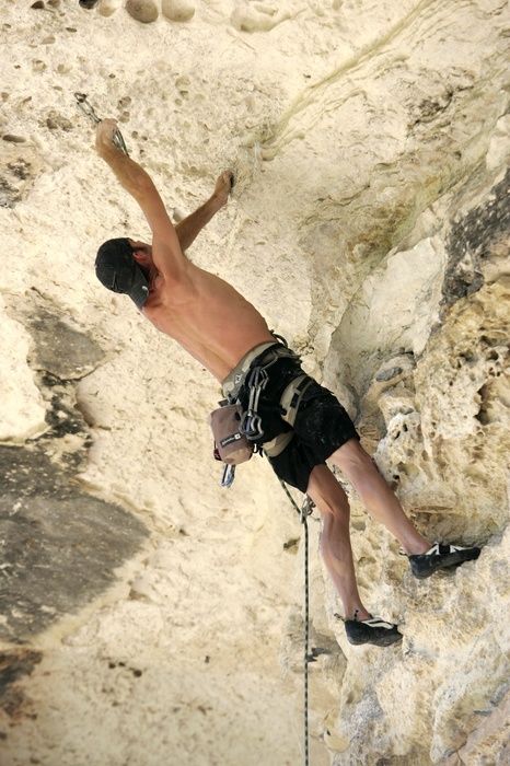 Tyler climbing Lonsome Dove (5.12), the roof above Diving for Rocks.  It was another long day of rock climbing at Seismic Wall on Austin's Barton Creek Greenbelt, Sunday, June 7, 2009.

Filename: SRM_20090607_13385377.jpg
Aperture: f/4.0
Shutter Speed: 1/500
Body: Canon EOS-1D Mark II
Lens: Canon EF 80-200mm f/2.8 L