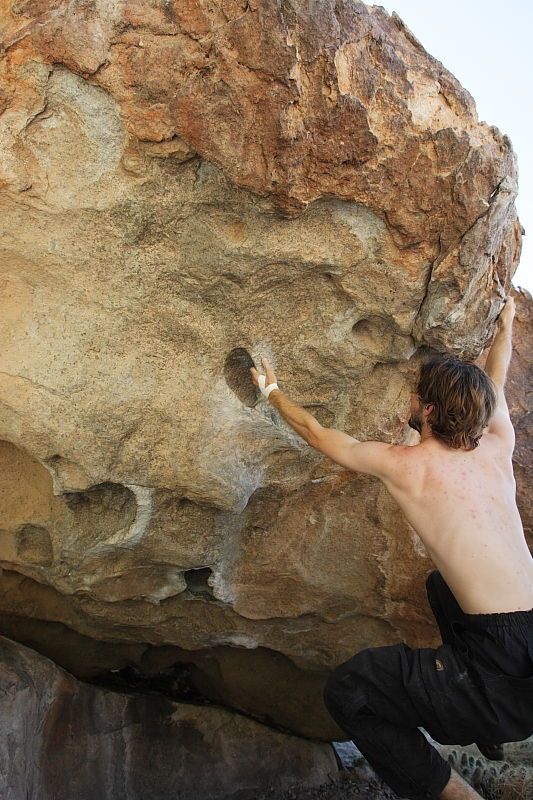 Andrew Dreher rock climbing on No One Gets Out of Here Alive (V2) in Hueco Tanks State Park and Historic Site during the Hueco Tanks Awesome Fest 2010 trip, Sunday, May 23, 2010.

Filename: SRM_20100523_10520351.JPG
Aperture: f/5.6
Shutter Speed: 1/640
Body: Canon EOS-1D Mark II
Lens: Canon EF 16-35mm f/2.8 L
