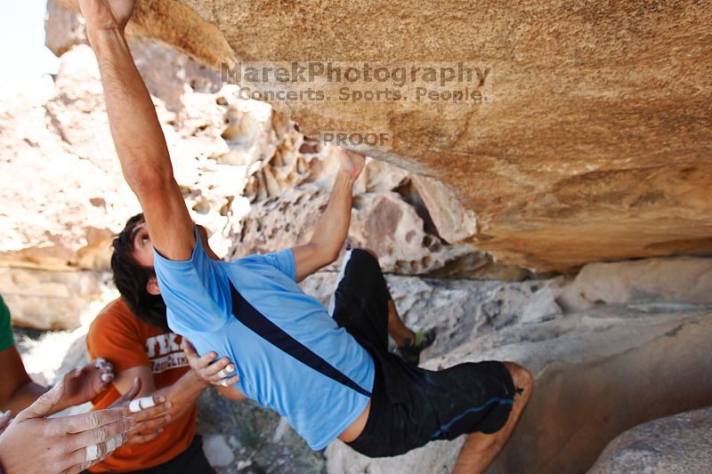 Javier Morales rock climbing on Mexican Chicken (V6) in Hueco Tanks State Park and Historic Site during the Hueco Tanks Awesome Fest 2010 trip, Monday, May 24, 2010.

Filename: SRM_20100524_12173921.JPG
Aperture: f/4.0
Shutter Speed: 1/400
Body: Canon EOS-1D Mark II
Lens: Canon EF 16-35mm f/2.8 L